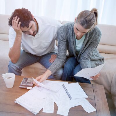Depressed couple doing their accounting